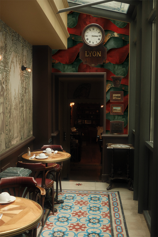 Dining area with tables and chairs in a cozy restaurant setting, featuring a decorative wall with a clock and 'LYON' sign.